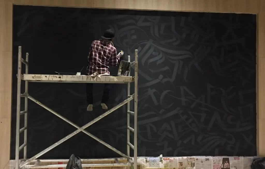 wicked broz artist creating graffit art for advant 2