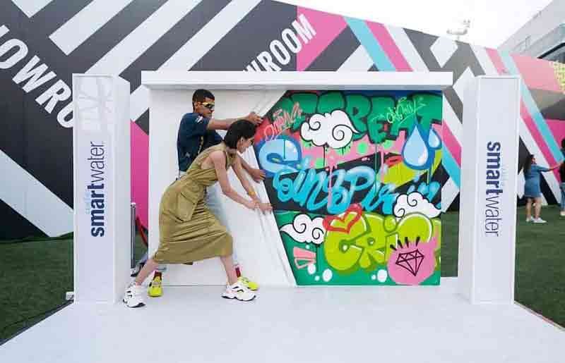 models pose at jio world drive lakme fashion week 2020 with smartwater graffiti done by wicked broz