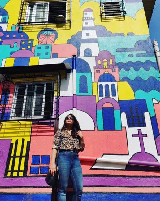 posing at tribes stays girls hostel street art mumbai