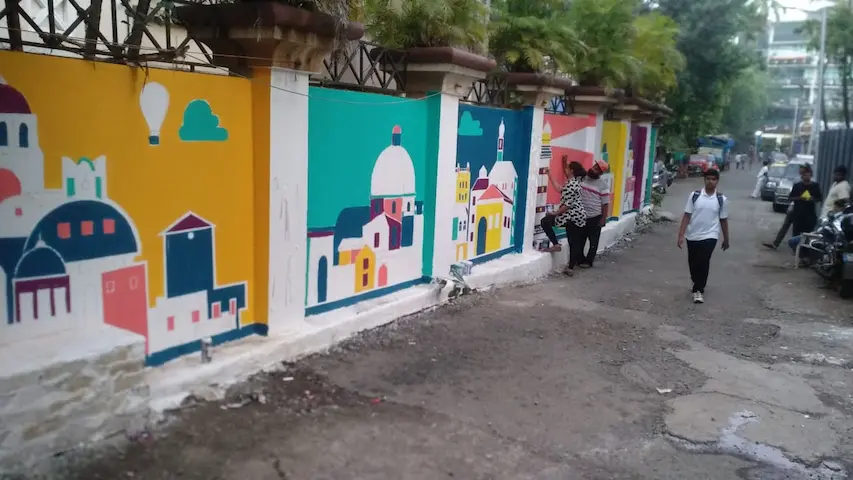 tribe stays girls hostel wall art at ville parle designed by wicked broz artist3